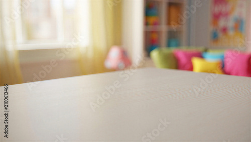 Photos Blurred playroom background with wooden table surface in foreground background p