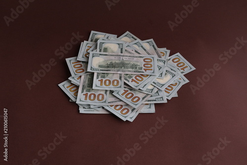 Obraz na płótnie Heap of Hundred Dollar Bills as a Financial Concept of Wealth and Savings