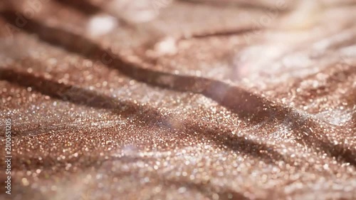 Close-up of Shimmering Metallic Surface with Glitter Effect.