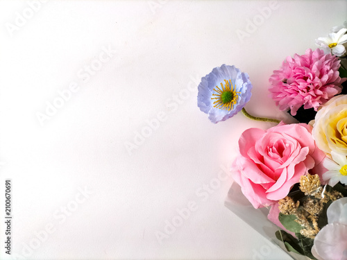 Canvastavla Colorful bouquet of artificial flowers on a white background.