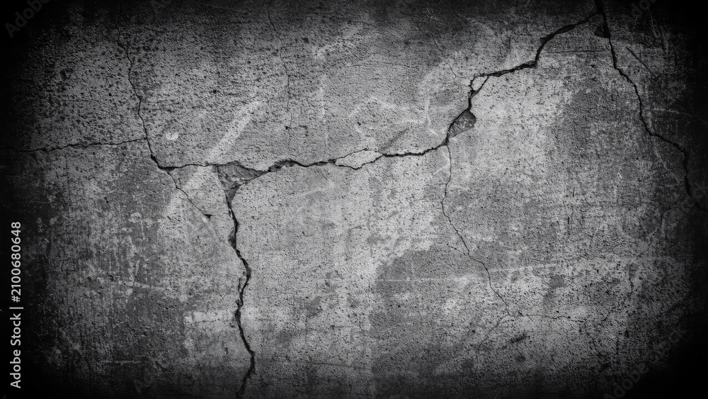 Obraz premium Cracked gray concrete wall texture with dark vignette edges