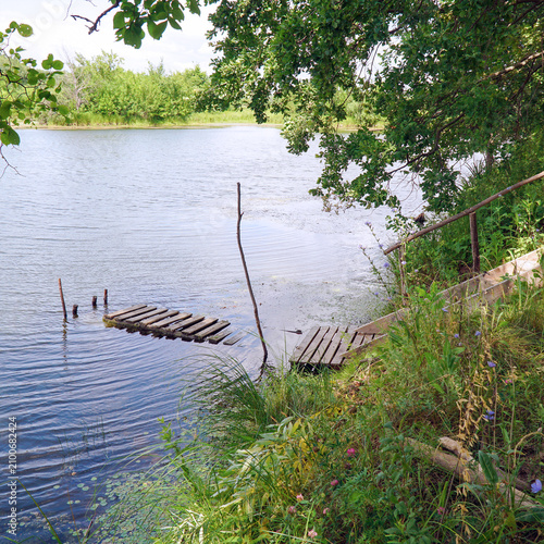 Wooden pier on a calm lake shore