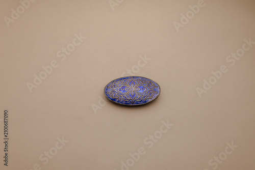 Canvas Print Elegant oval blue decorative ornament with intricate golden patterns on a serene