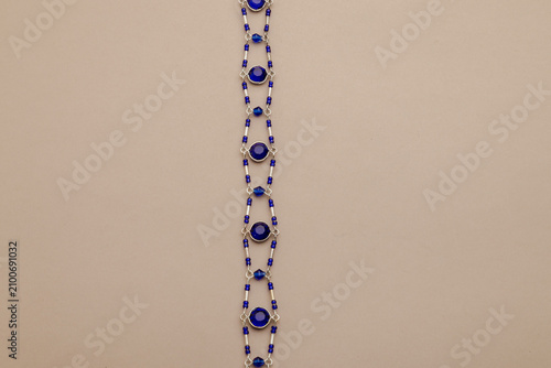 Photography Elegant blue and silver beaded jewelry with circular gems, a luxurious accessory