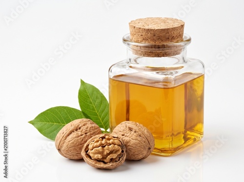 Natural wellness scene featuring a glass bottle of golden walnut oil and cracked walnuts, highlighting healthy cooking and organic skincare ingredients.