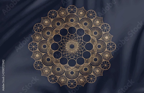 Intricate golden mandala design on a dark textured background