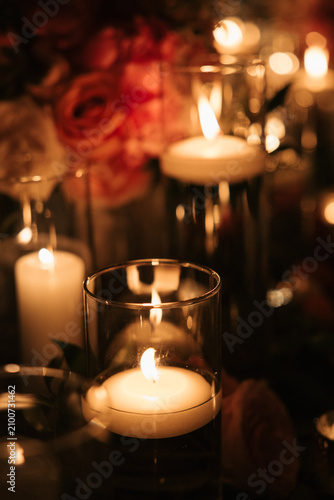 Romantic candlelit wedding reception table with warm glowing votives