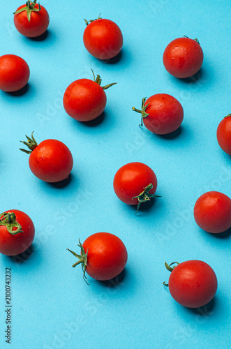 red tomatoes on a blue
 background