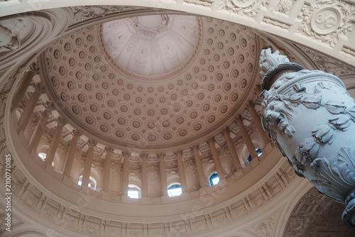 Elegant architectural details inside San Francisco City Hall  featuring ornate Beaux-Arts design  decorative columns  marble surfaces  intricate craftsmanship  and historic civic architecture.