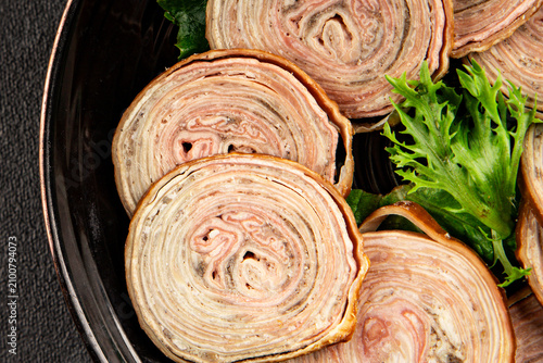 Bild auf Leinwand Andouille de Guemene sausage, French cuisine sliced smoked sausages casings meat