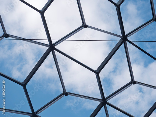Low Angle View of Modern Geodesic Dome Architectural Glass Roof against Blue Sky
