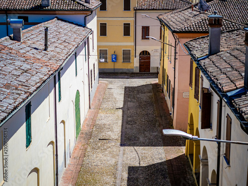 Sabbioneta street view with traditional Italian architecture and terracotta roofs
