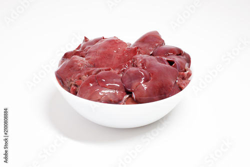 Canvastavla Raw chicken liver in a white ceramic bowl isolated on a white background