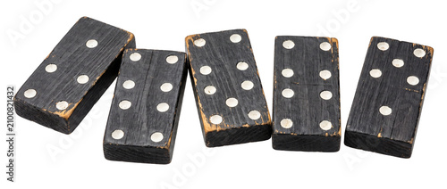 Vintage black wooden dominoes tiles on isolated black background antique rustic board game pieces with distressed texture and hand painted white dots classic strategy play pastime set leisure objects