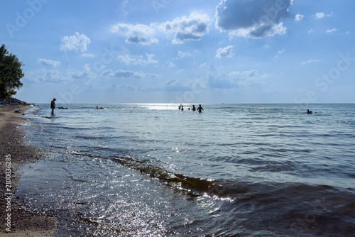 People enjoying the water and shoreline
