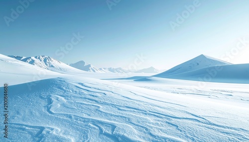A vast icy landscape with snow-covered mountains under a clear blue sky