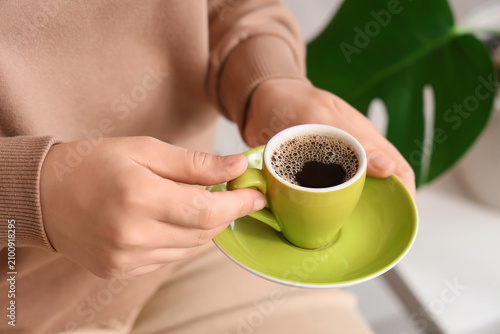 Person holding a small gree...