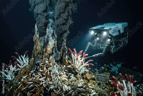 Tall hydrothermal vent chimney supporting diverse deep ocean life forms