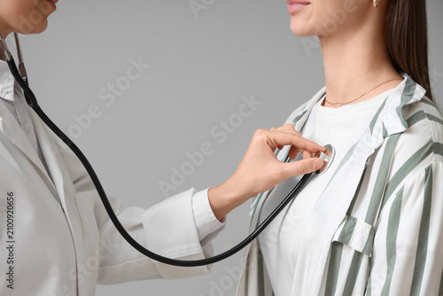 Doctor examining a patient ...