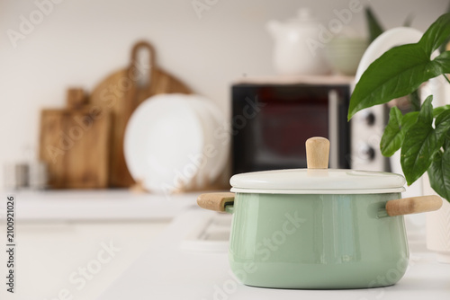 Green cooking pot on counte...