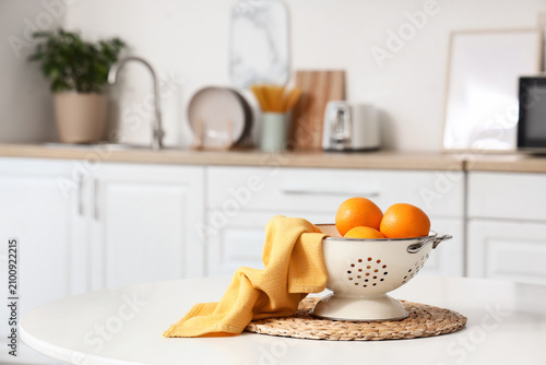 Fresh oranges in a white co...
