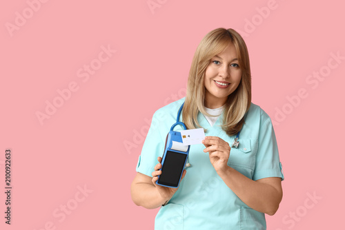 Female doctor with payment ...
