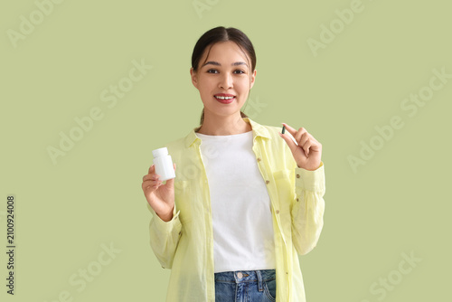Young Asian woman with vita...
