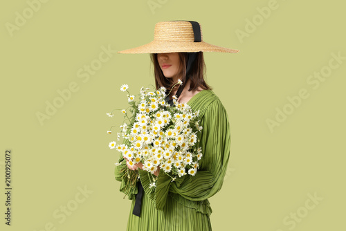 Young woman in wicker hat w...