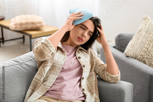 Young woman warming her hea...