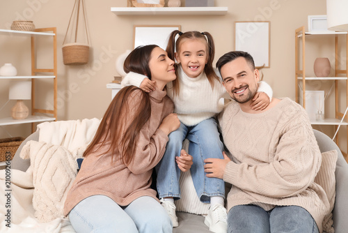 Happy family with their dau...