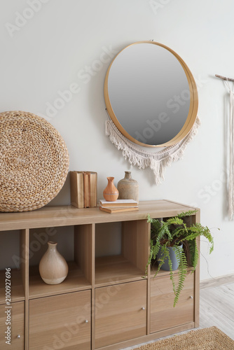 Mirror with tapestry on lig...