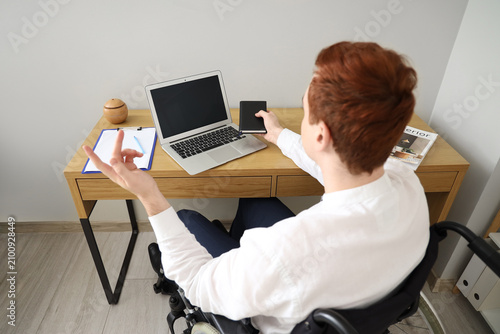 Young businessman in wheelc...