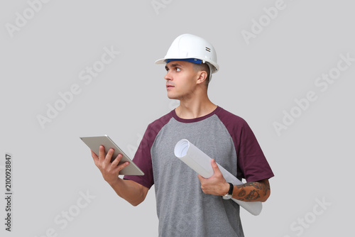 Young male engineer with ta...