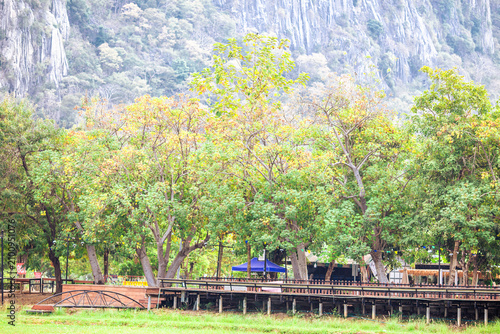 Natural background on the top of a high mountain with panoramic view of trees, sky, big mountains and cool breeze blowing while traveling in nature.