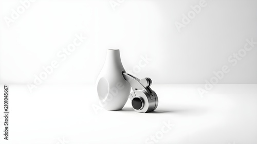 Minimalist White Ceramic Vase and Sleek Metal Tape Dispenser Arranged in a Bright Modern Studio Setting