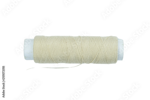 Professional white sewing thread spool presented isolated on a transparent background.