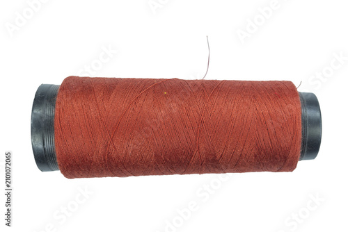 Tableau sur toile Professional orange sewing thread spool presented isolated on a transparent background