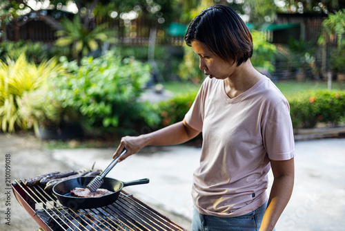 Photos Asian Woman Cooking Traditional Food On Charcoal Stove