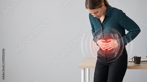 Woman suffering from abdominal pain