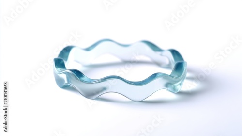 Wavy translucent blue glass bangle bracelet with a fluid, organic design