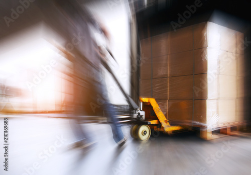 Motion Blurred of Workers Loading Shipment into The Truck. Forklift Loader. Bulk of Package Boxes Pallets. Distribution Storage Warehouse. Supply Chain, Supplies Shipping. Logistics Transportation.