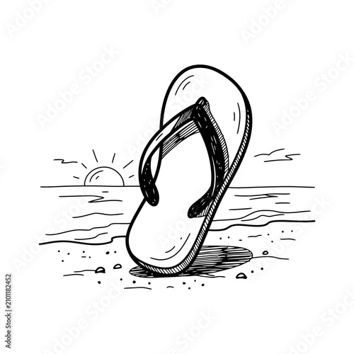 A Flip-flop On The Beach At Sunset
