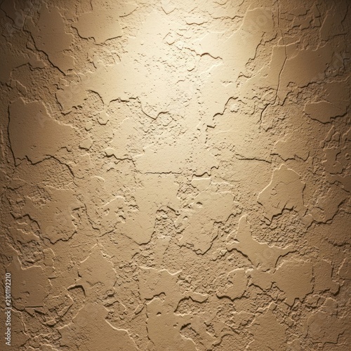 Textured wall surface with abstract relief pattern and overhead lighting