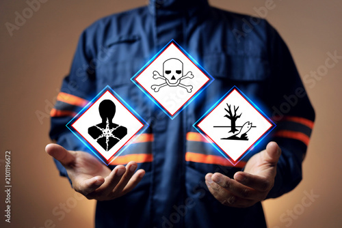 hazardous substance concept safety staff holding dangerous goods sign to inform materials safety data sheet to worker in area