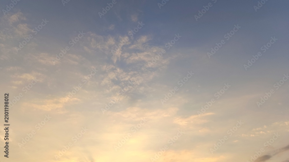 Fototapeta premium Soft clouds drift in twilight's gentle glow
