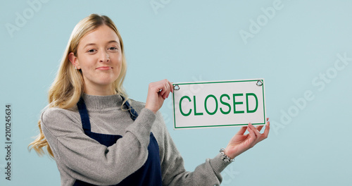 Tableau sur toile Closed, sulking and portrait of woman as cafe owner in studio for failure, announcement or signage