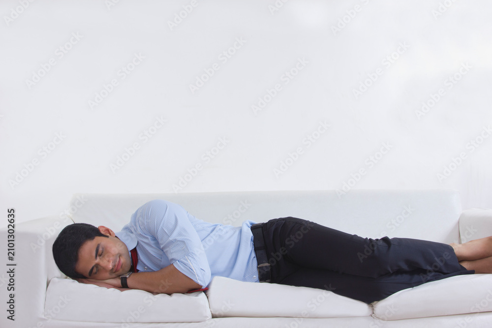 Obraz premium Man sleeping on sofa