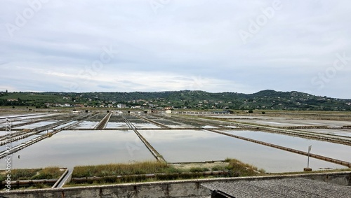 Fotografie Wide panoramic view of salt evaporation ponds at Secovlje Salina Nature Park in