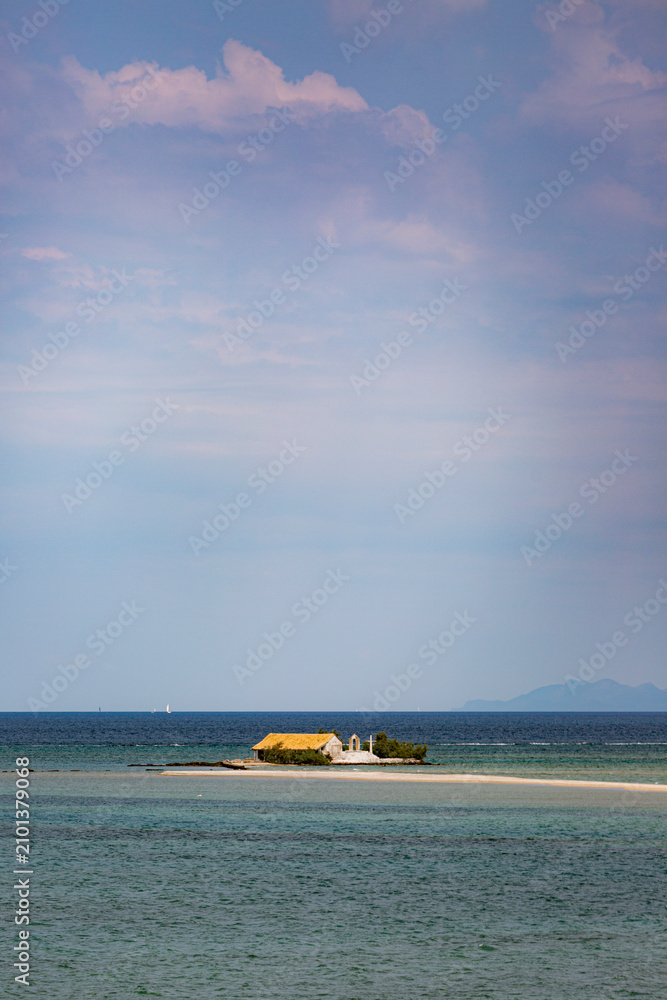 Fototapeta premium Agios nikolaos church on small island in ionian sea