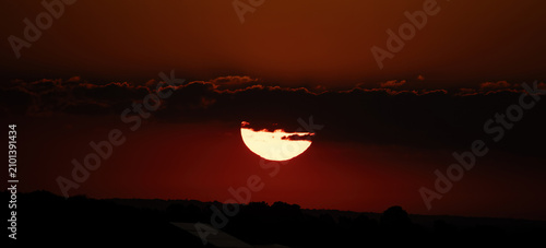 sunrise and clouds in a red sky